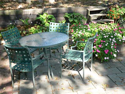 patio table and chairs with flowers
